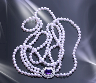 An iconic triple strand akoya pearl, diamond, and blue sapphire princess necklace evokes the timeless elegance of old-world couture. 